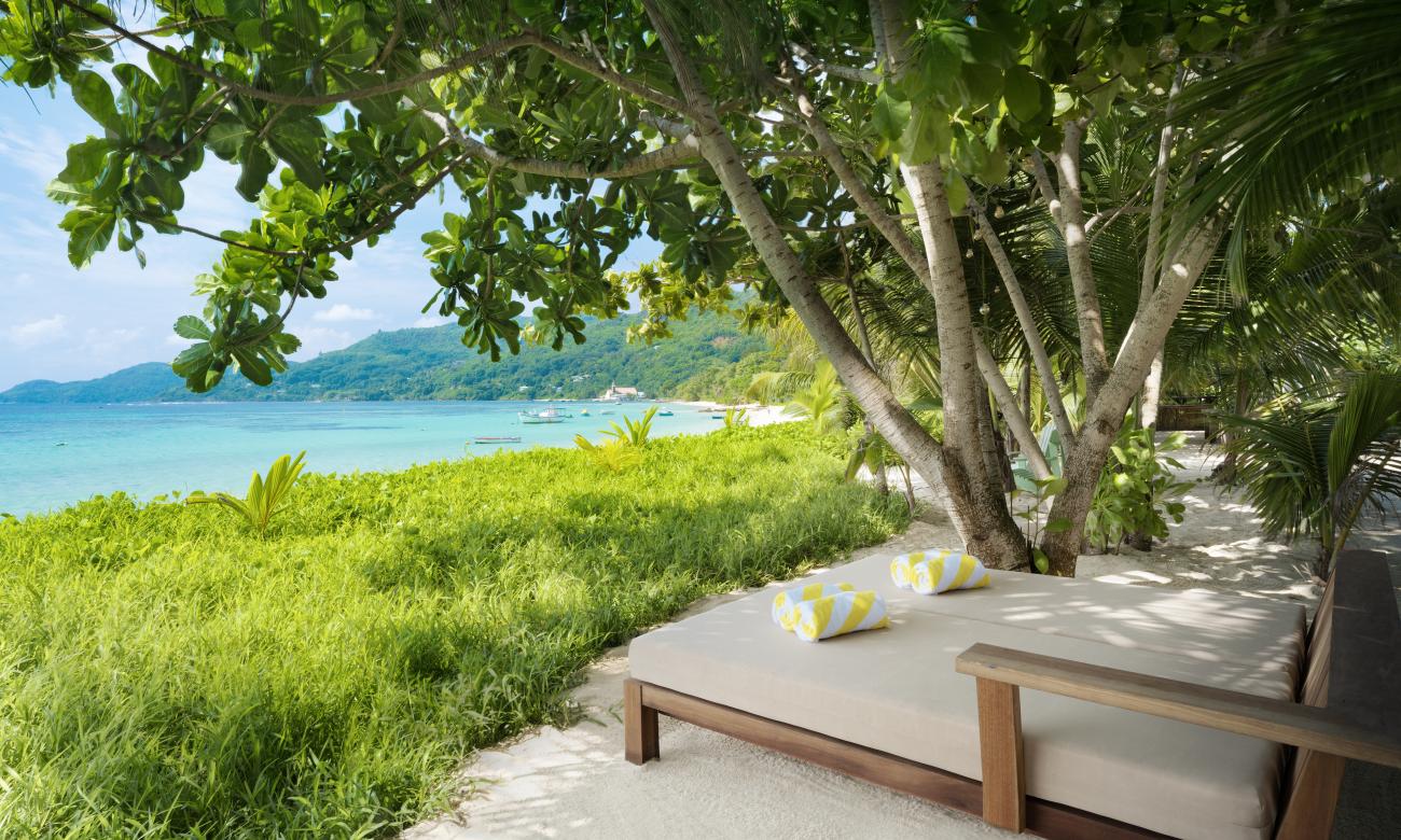 daybed at Kafe Kreol and view of the beach